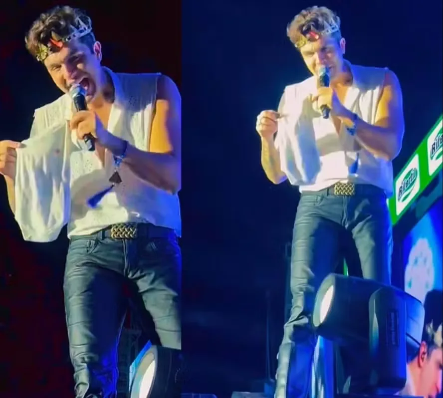 Luan Santana recebe roupinha de bebe durante show