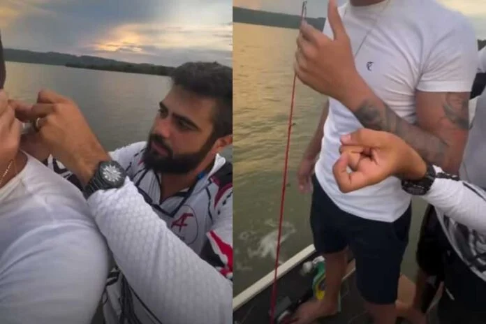 Henrique, da dupla Henrique e Juliano, fisga pescoço de amigo durante pescaria; VEJA VÍDEO