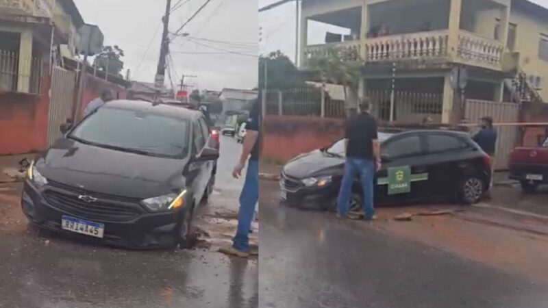 Carro da Prefeitura cai em buraco e deixa frente do veículo completamente presa em Cuiabá; veja vídeo