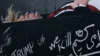 Trump aparece dentro de caixão em mural com mensagem polêmica; veja vídeo